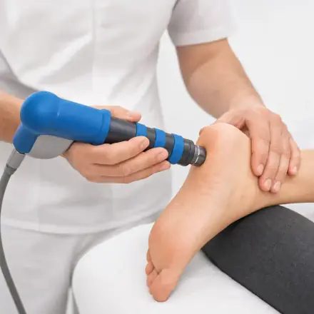Radial shockwave therapy handpiece applied to the plantar heel